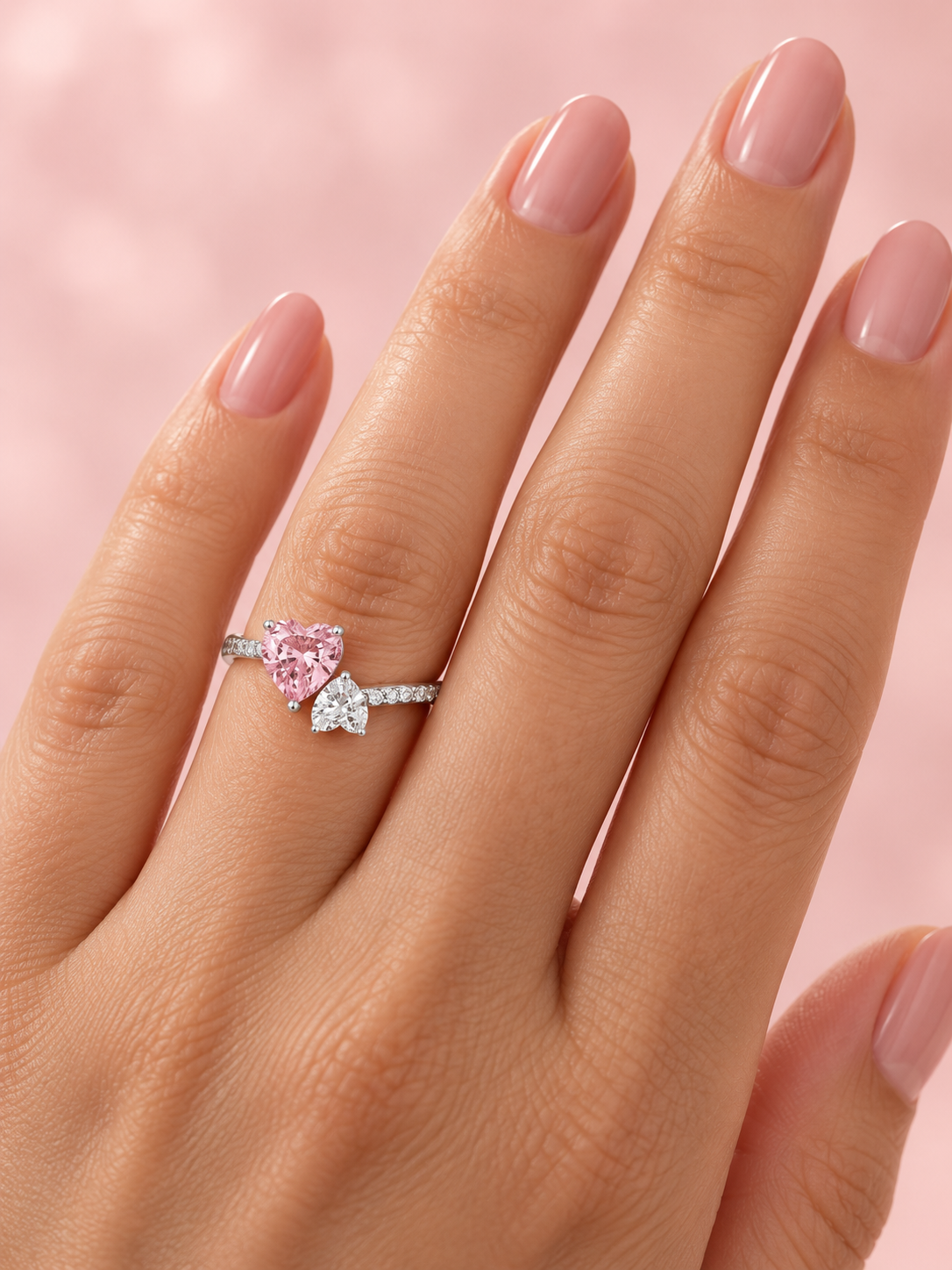 Anillo doble corazón blanco rosa logo